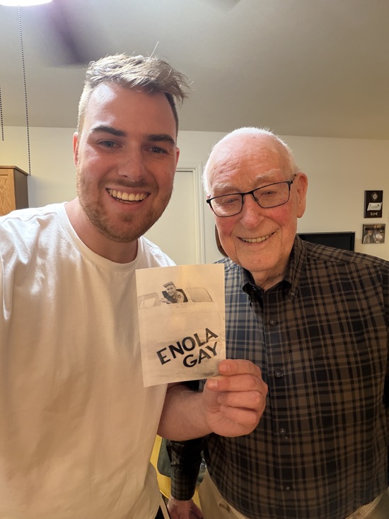 Norris Jernigan with historian Jiri Kluc, holding an Enola Gay photograph.