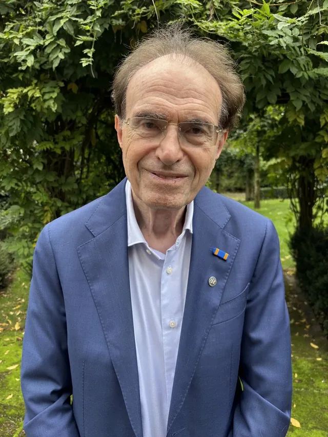 Portrait of Ronald Waterman in a garden.