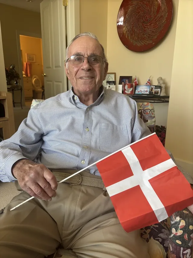 Steen Metz holding a Danish flag.